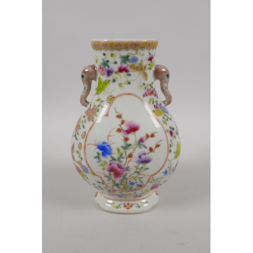 43 - A late C19th/early C20th Chinese famille verte vase with two elephant mask handles and floral decora... 