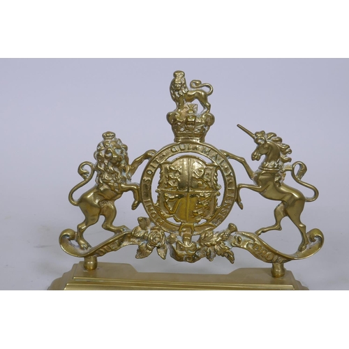 5 - A C19th cast brass door stop in the form of the Royal Coat of Arms, 30 x 26cm high