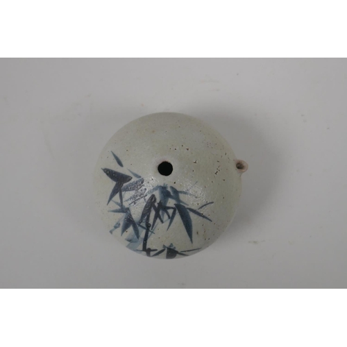 50 - A Korean blue and white pottery water dropper with bamboo decoration, 9cm diameter