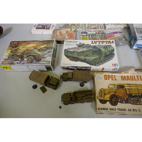 56 - A collection of vintage military model kits by Tamioja, Italeri, Heller, Revell etc, and seven compl... 