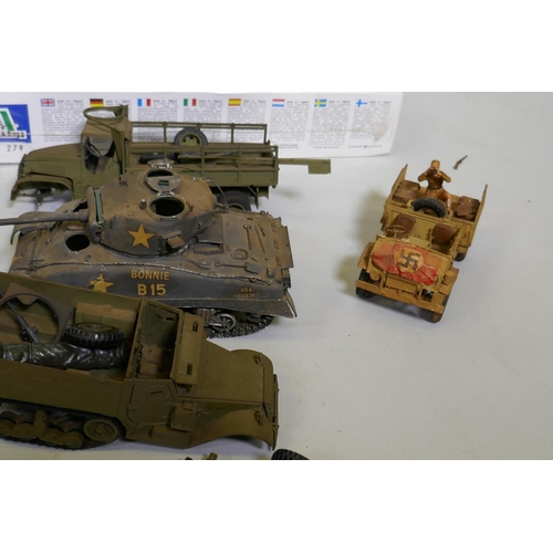 56 - A collection of vintage military model kits by Tamioja, Italeri, Heller, Revell etc, and seven compl... 