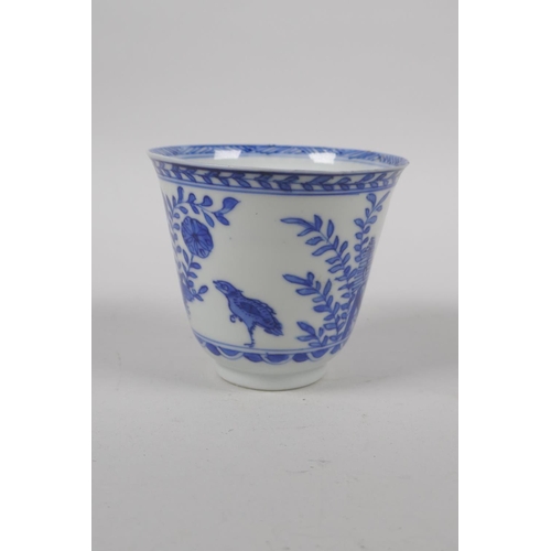 6 - An C18th Chinese KangXi blue and white porcelain wine cup, decorated with quail and flowers, marked ... 