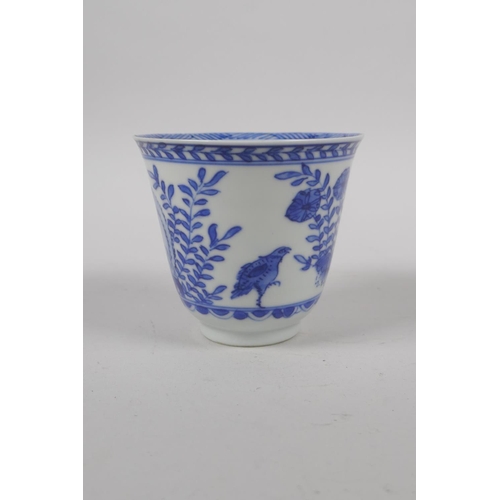 6 - An C18th Chinese KangXi blue and white porcelain wine cup, decorated with quail and flowers, marked ... 