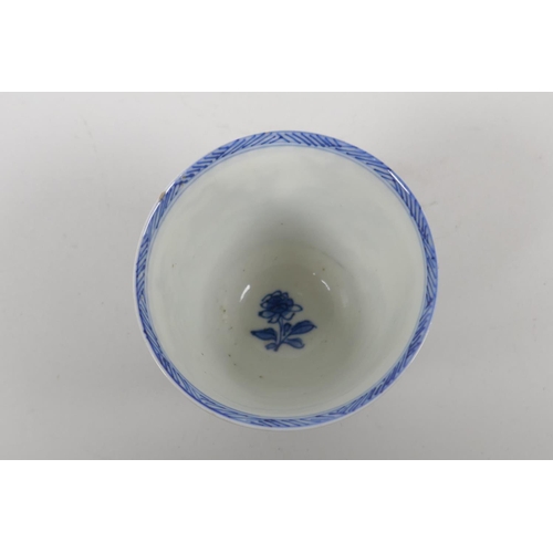 6 - An C18th Chinese KangXi blue and white porcelain wine cup, decorated with quail and flowers, marked ... 