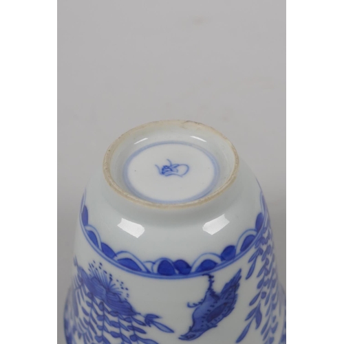 6 - An C18th Chinese KangXi blue and white porcelain wine cup, decorated with quail and flowers, marked ... 