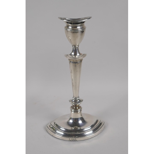 604 - A pair of antique silver candlesticks by Williams (Birmingham) Ltd, 1911, weighted, 973g gross, 25cm... 