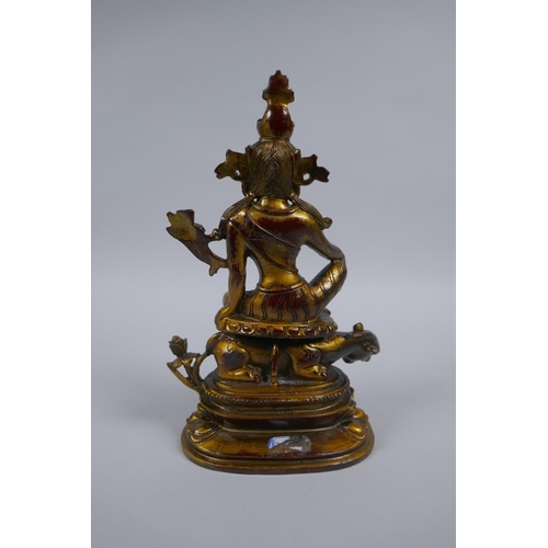 61 - A Sino Tibetan gilt metal figure of Tara, 21cm high