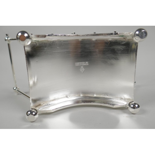 612 - A Christopher Dresser style silver plated toast/letter rack, 22cm long