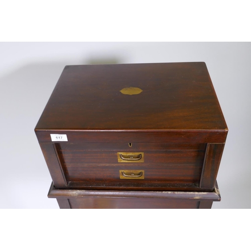 617 - A mahogany cutlery canteen, with lift up top over two pull out drawers with fitted interior and carr... 