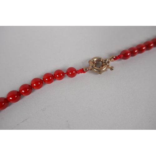 629 - A coral beaded necklace, 80cm long