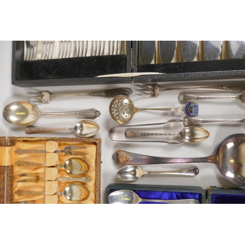 635 - A collection of hallmarked silver tea spoons, tea scoop, sugar tongs etc, and a quantity of silver p... 