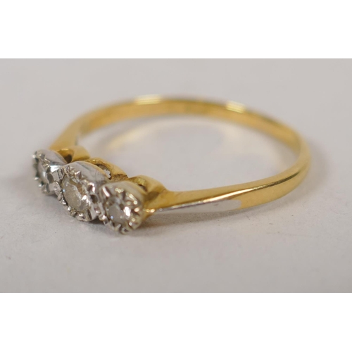 636 - A high carat gold and platinum three stone diamond ring, size N/O