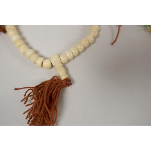 648 - Six assorted strings of Tibetan mala beads in bone, glass, hardstone, etc