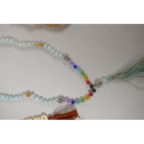 648 - Six assorted strings of Tibetan mala beads in bone, glass, hardstone, etc