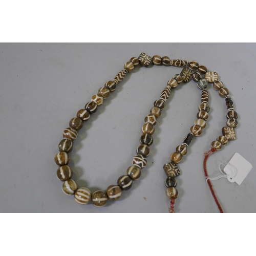 649 - A string of agate beads, 90cm long