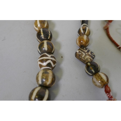 649 - A string of agate beads, 90cm long