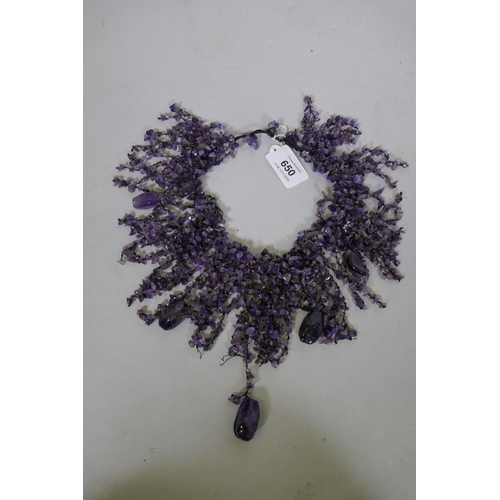 650 - An uncut amethyst stone necklace, 26cm long