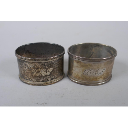 656 - A solid silver ingot, London 1973, and four hallmarked silver napkin rings, 294g