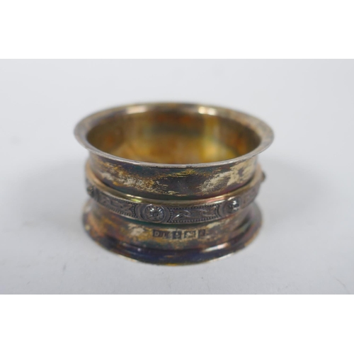 656 - A solid silver ingot, London 1973, and four hallmarked silver napkin rings, 294g