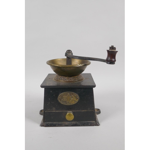 66 - An early C20th painted cast iron 'Dinah' mechanical money box, 17cm high, and a vintage coffee bean ... 