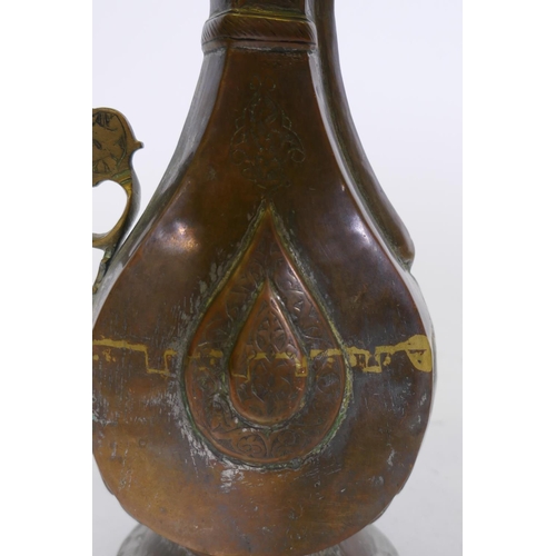 74 - A Middle Eastern copper and mixed metal ewer/jug with Islamic boteh decoration, 21cm high