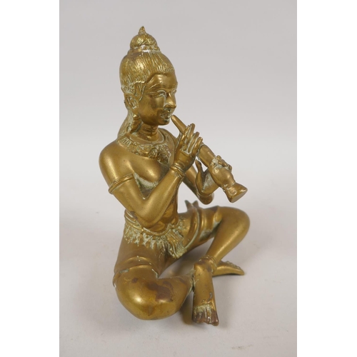 79 - An antique Thai bronze figure of a seated musician, 15cm high