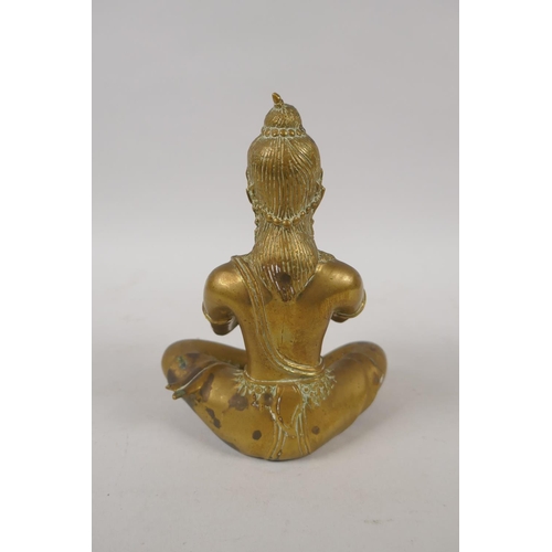 79 - An antique Thai bronze figure of a seated musician, 15cm high