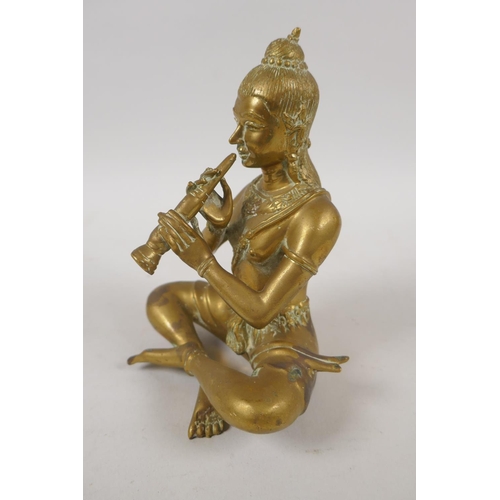 79 - An antique Thai bronze figure of a seated musician, 15cm high