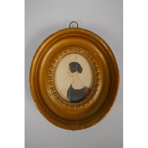 803 - A C19th gilt framed miniature portrait of a young lady, and a C19th silhouette portrait of a gentlem... 