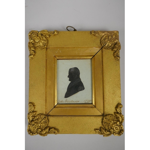 803 - A C19th gilt framed miniature portrait of a young lady, and a C19th silhouette portrait of a gentlem... 