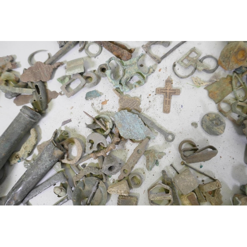 82 - Collection of bronze, brass, iron and mixed metal mounts, rings, buttons, pendants, buckles and frag... 