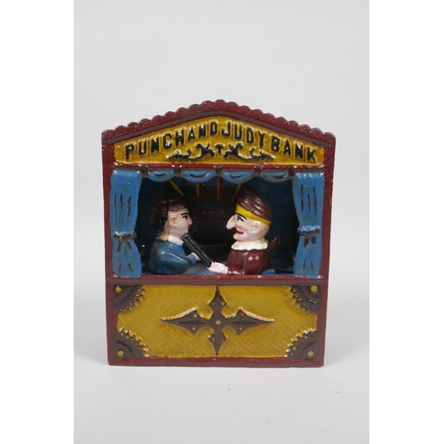 91 - A vintage style painted cast iron Punch and Judy mechanical money box, 18cm high