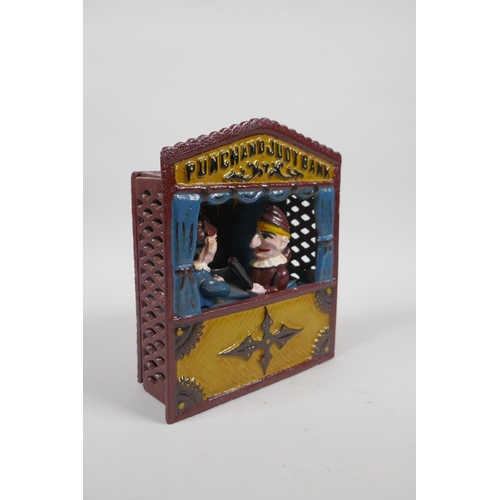 91 - A vintage style painted cast iron Punch and Judy mechanical money box, 18cm high