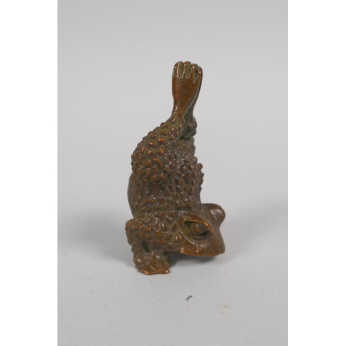 92 - A Japanese style bronze okimono of a toad, 5cm high