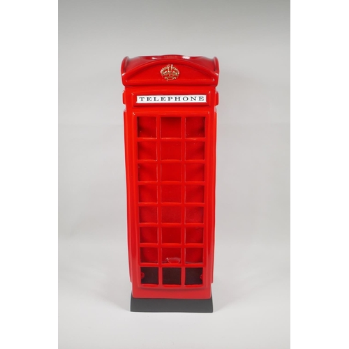 99 - A painted cast metal umbrella stand in the form of a telephone box, 57cm high