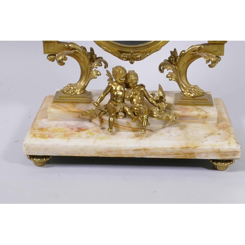 10 - A C19th French onyx and ormolu swing table mirror, decorated with cupids and classical details, with... 