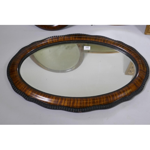 1066 - Three oval wall mirrors, largest 84 x 56cm, and a gilt framed wall mirror