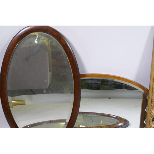 1066 - Three oval wall mirrors, largest 84 x 56cm, and a gilt framed wall mirror