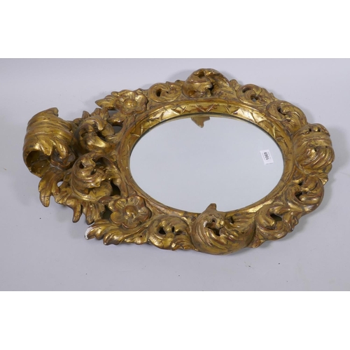 1069 - An Italian carved giltwood wall mirror, 67cm high