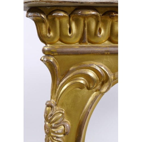 1087 - A Regency carved and watergilt console table with concave Carrara marble top, raised on shaped suppo... 