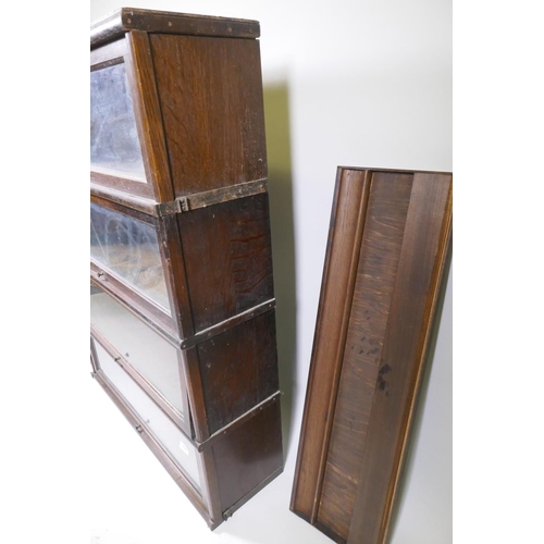 1090 - Globe Wernicke bookcase in oak of four sections, with two tops but lacking base section, each sectio... 