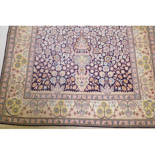 1091 - An antique Indian Agra silk carpet with tree of life and millefiori design, 125 x 200