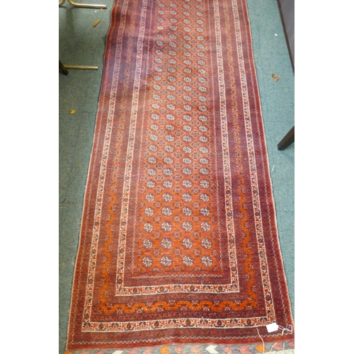 1098 - A hand woven wool Bokhara runner, 385 x 89cm