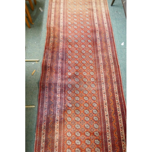 1098 - A hand woven wool Bokhara runner, 385 x 89cm