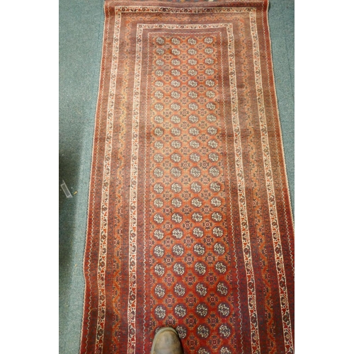 1098 - A hand woven wool Bokhara runner, 385 x 89cm