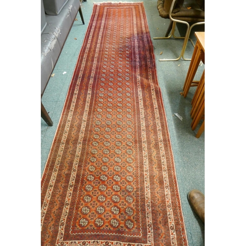 1098 - A hand woven wool Bokhara runner, 385 x 89cm