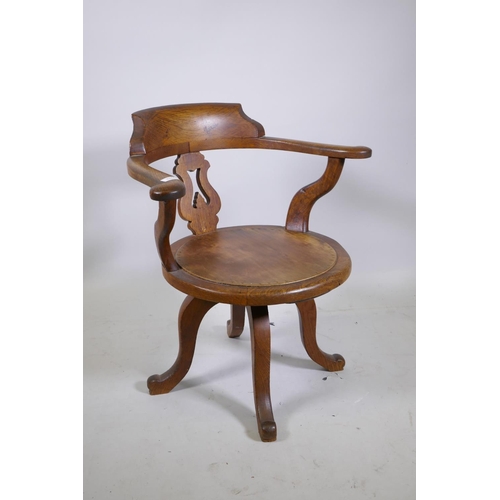 1165 - A 1930s oak swivel office desk chair