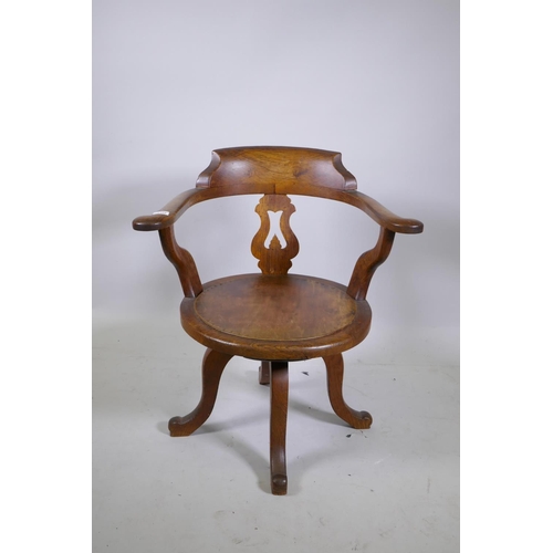 1165 - A 1930s oak swivel office desk chair