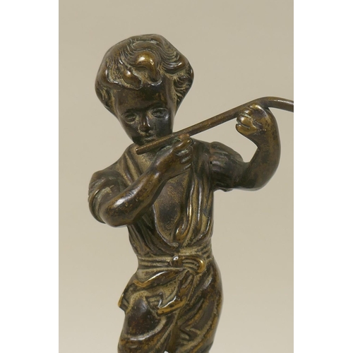 19 - An antique solid cast bronze figure of a boy with a flute mounted on a marble base, 28cm high