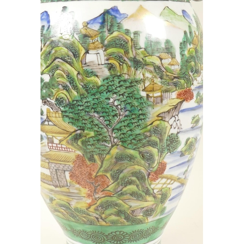 20 - An antique Kutani vase with butterfly handles, decorated with an extensive landscape, Fuku mark to b... 